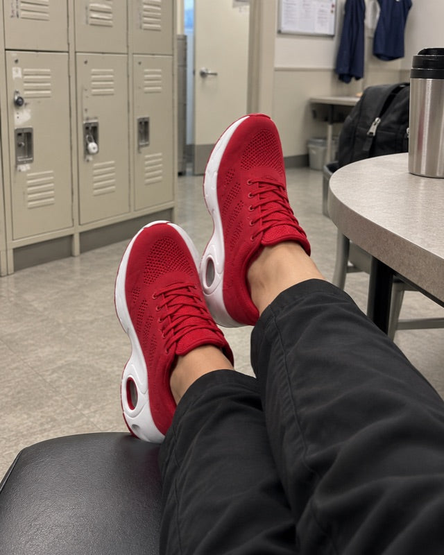 The red shoes, feet up in the staff room